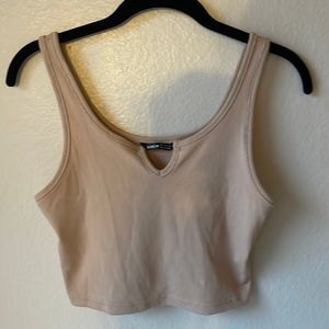 Tan tank top with small slit in middle of the top